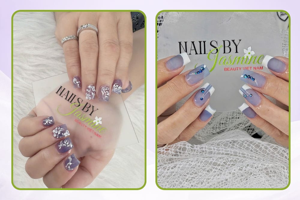 Mẫu nail học viên đắp bột trên tay thật, gồm 2 kiểu: vẽ hoa trắng trên nền tím khói và vẽ French trắng đính charm đá xanh.